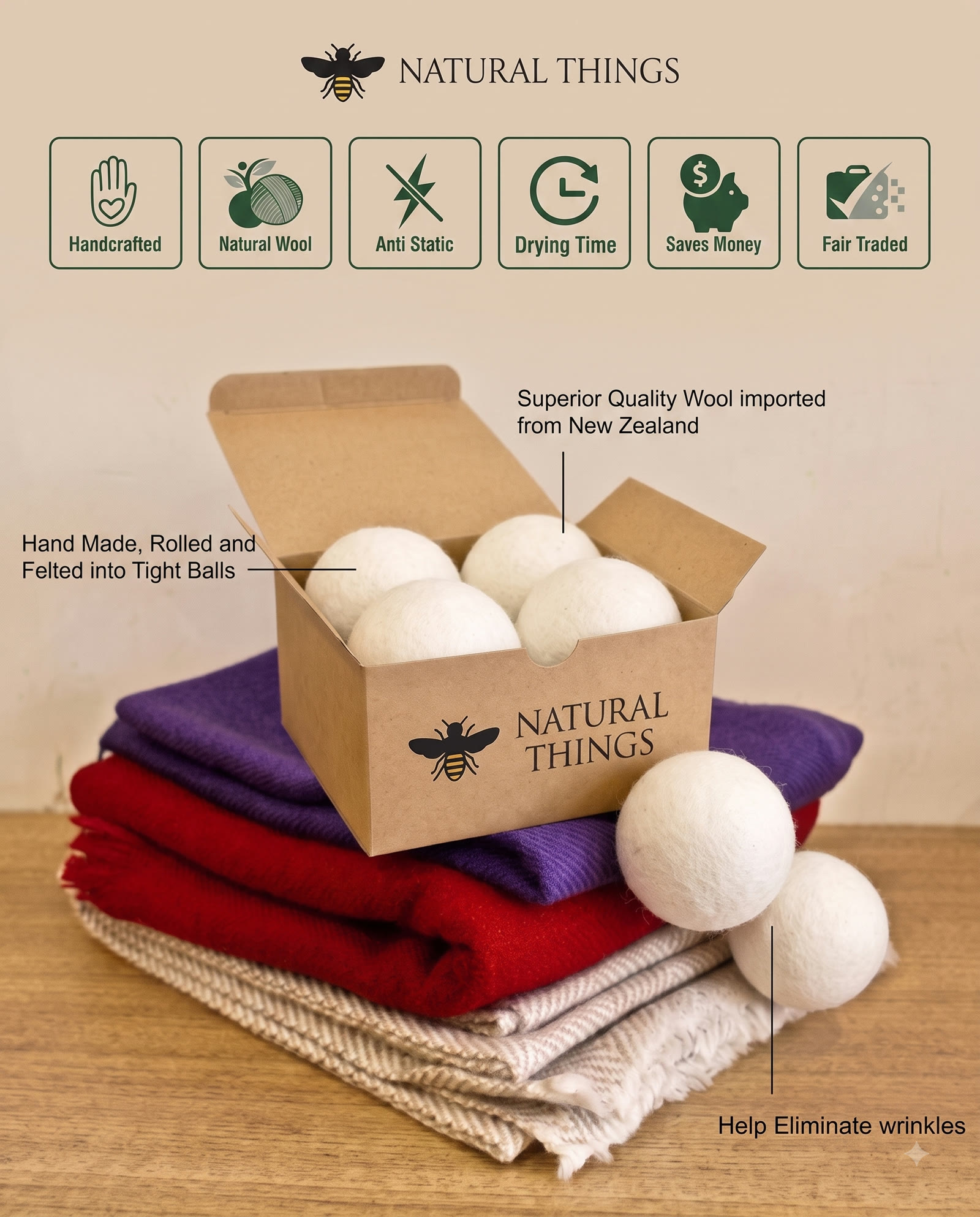 Natural Things wool dryer balls in an open kraft box, resting on folded blankets